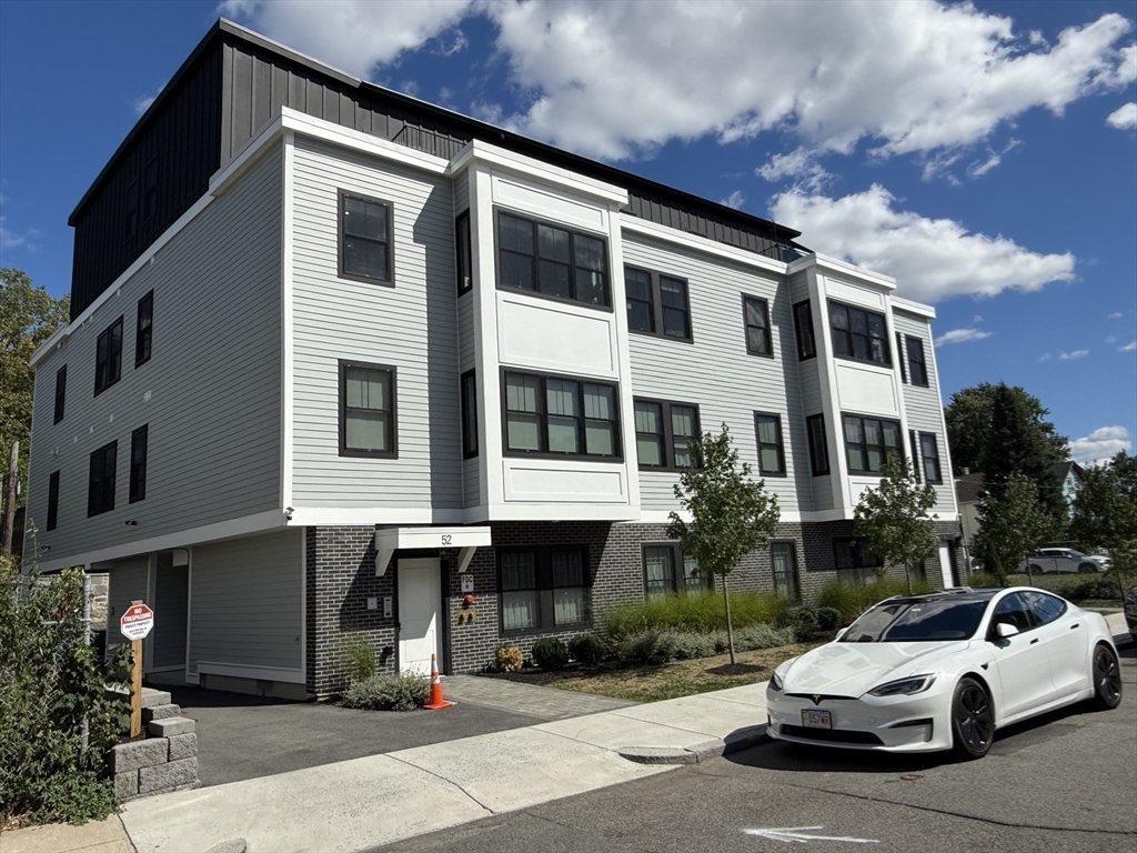 52 Withington Street, Unit 7 Boston, MA 02124 - Photo 28 of 32 a car parked in front of a building