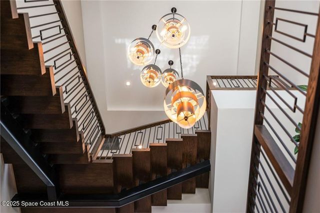 a balcony with furniture and a floor to ceiling window