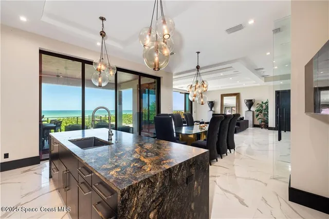 a large room with lots of counter top space and windows