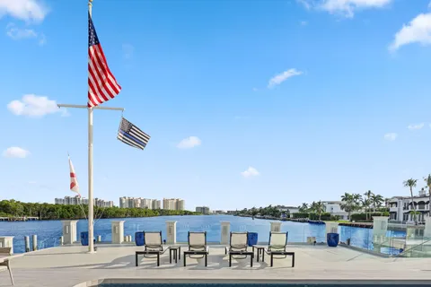 a view of a terrace with outdoor seating and city view