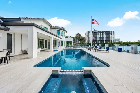 a view of a roof deck with furniture