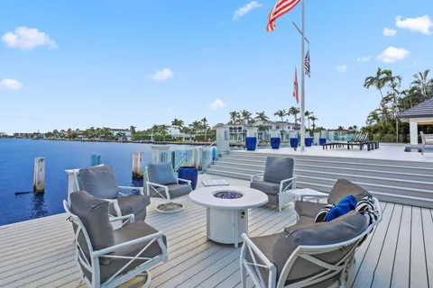 a large kitchen with a table and chairs