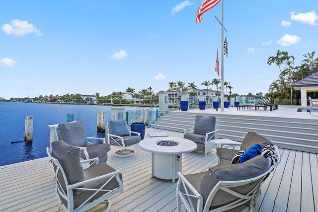 a large kitchen with a table and chairs