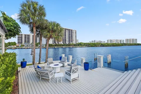 a large kitchen with a table and chairs