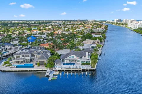 a front view of a house with a garden and plants