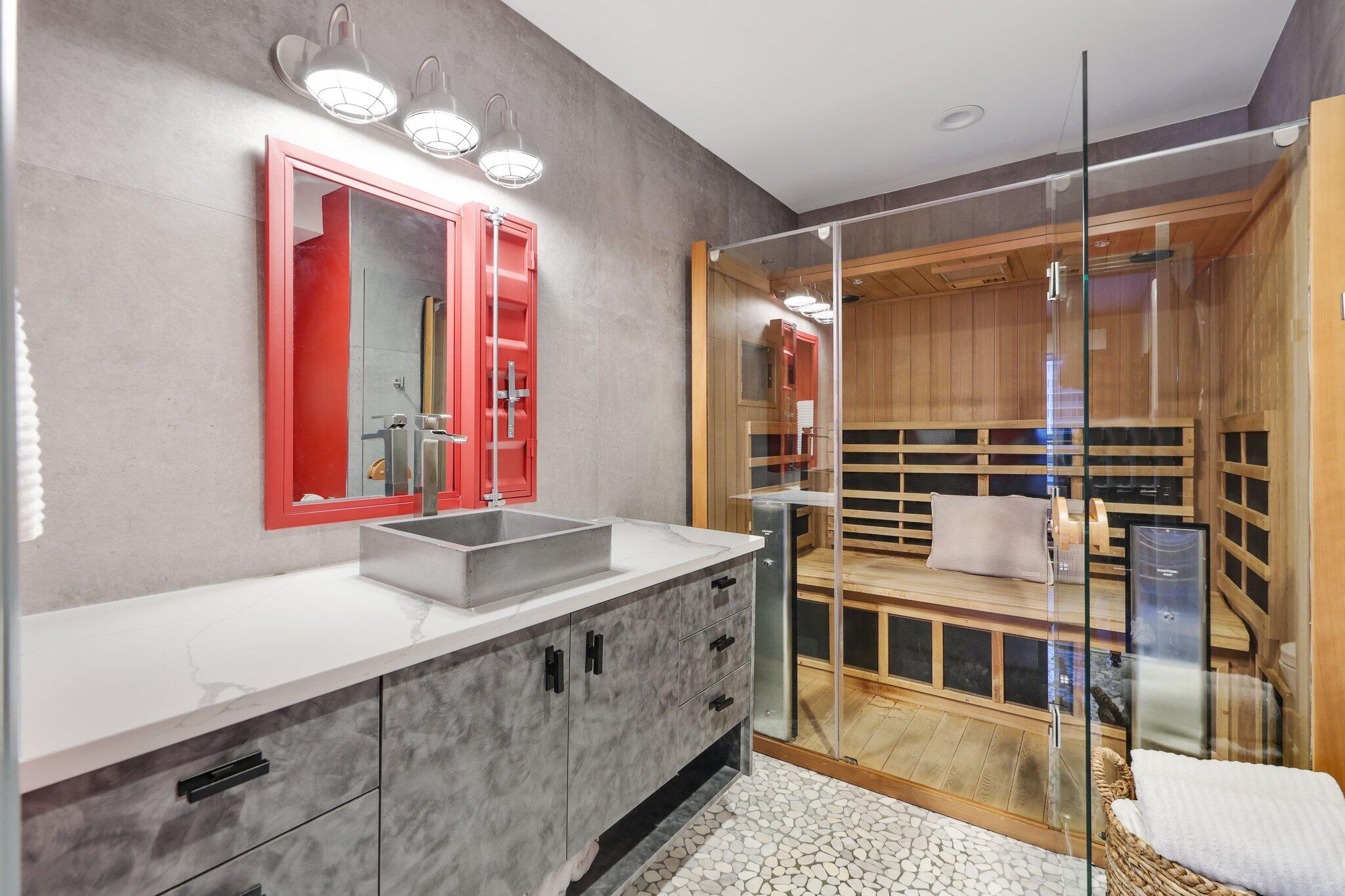 7400 Northeast Orchid Bay Drive Boca Raton, FL 33487 - Photo 47 of 63 a bathroom with a double vanity sink and a mirror