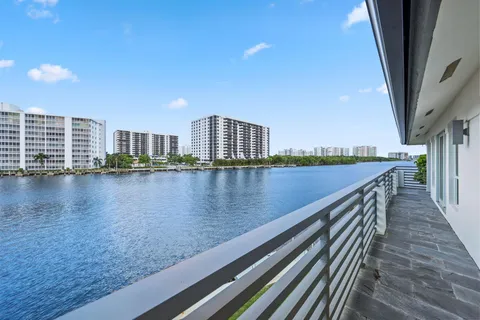 an aerial view of a house with a yard and garden in the back