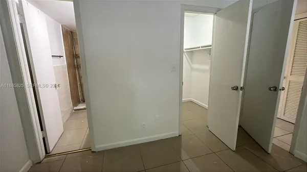 a view of an empty room and window