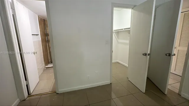 a view of an empty room and window