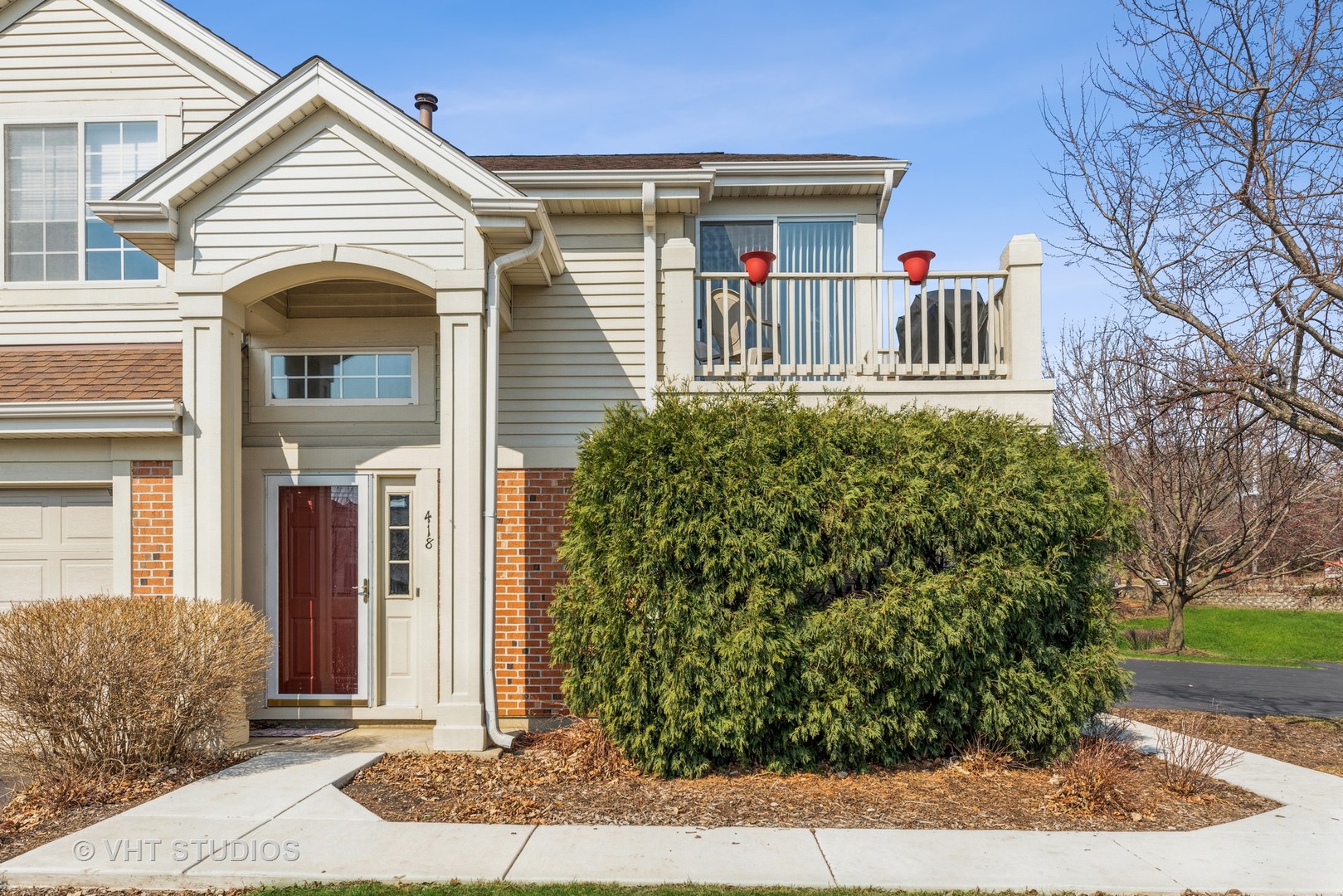 a front view of a house with garden
