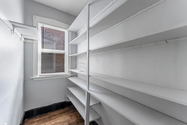 a room with window and a wooden floor