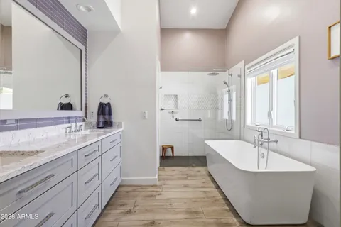 a bathroom with a mirror and two sink