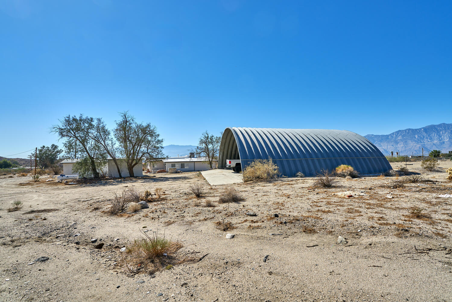 73300 Paradise Avenue Desert Hot Springs, CA 92241 - Photo 15 of 44 a view of a backyard of a house