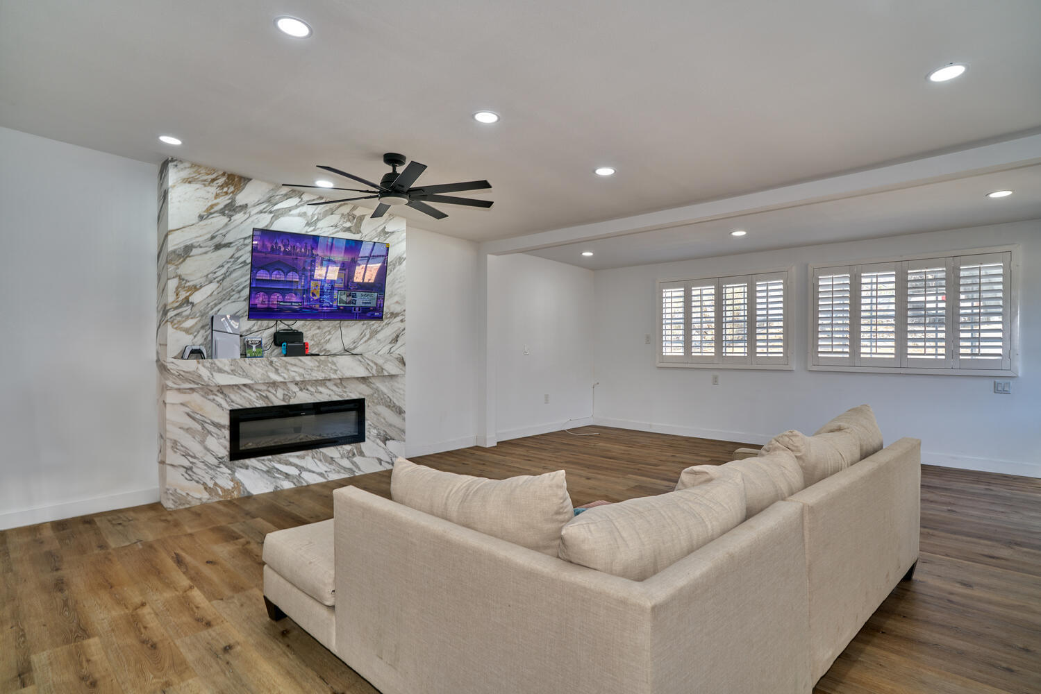 73300 Paradise Avenue Desert Hot Springs, CA 92241 - Photo 24 of 44 a living room with furniture and a fireplace
