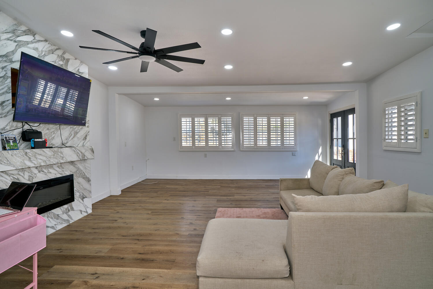 73300 Paradise Avenue Desert Hot Springs, CA 92241 - Photo 25 of 44 a living room with furniture and a fireplace