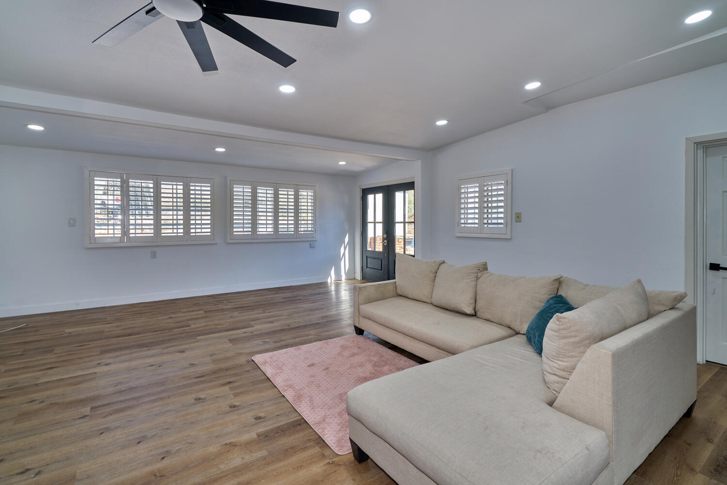 73300 Paradise Avenue Desert Hot Springs, CA 92241 - Photo 26 of 44 a living room with furniture and a wooden floor