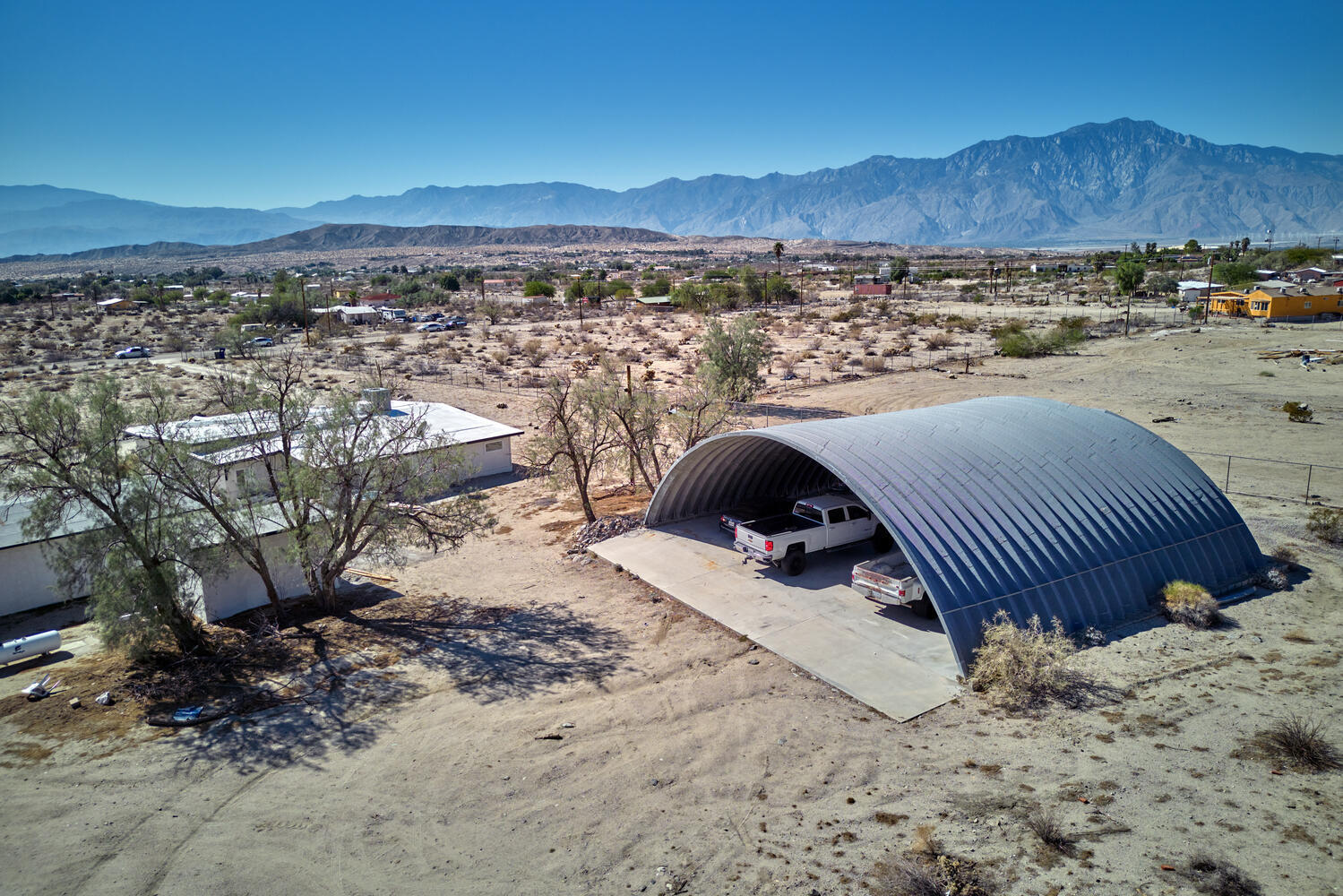 73300 Paradise Avenue Desert Hot Springs, CA 92241 - Photo 3 of 44 a view of a backyard of a house