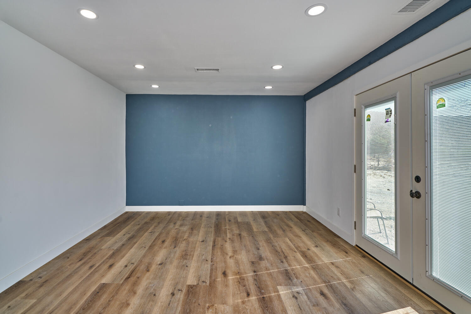 73300 Paradise Avenue Desert Hot Springs, CA 92241 - Photo 33 of 44 wooden floor in an empty room with a window