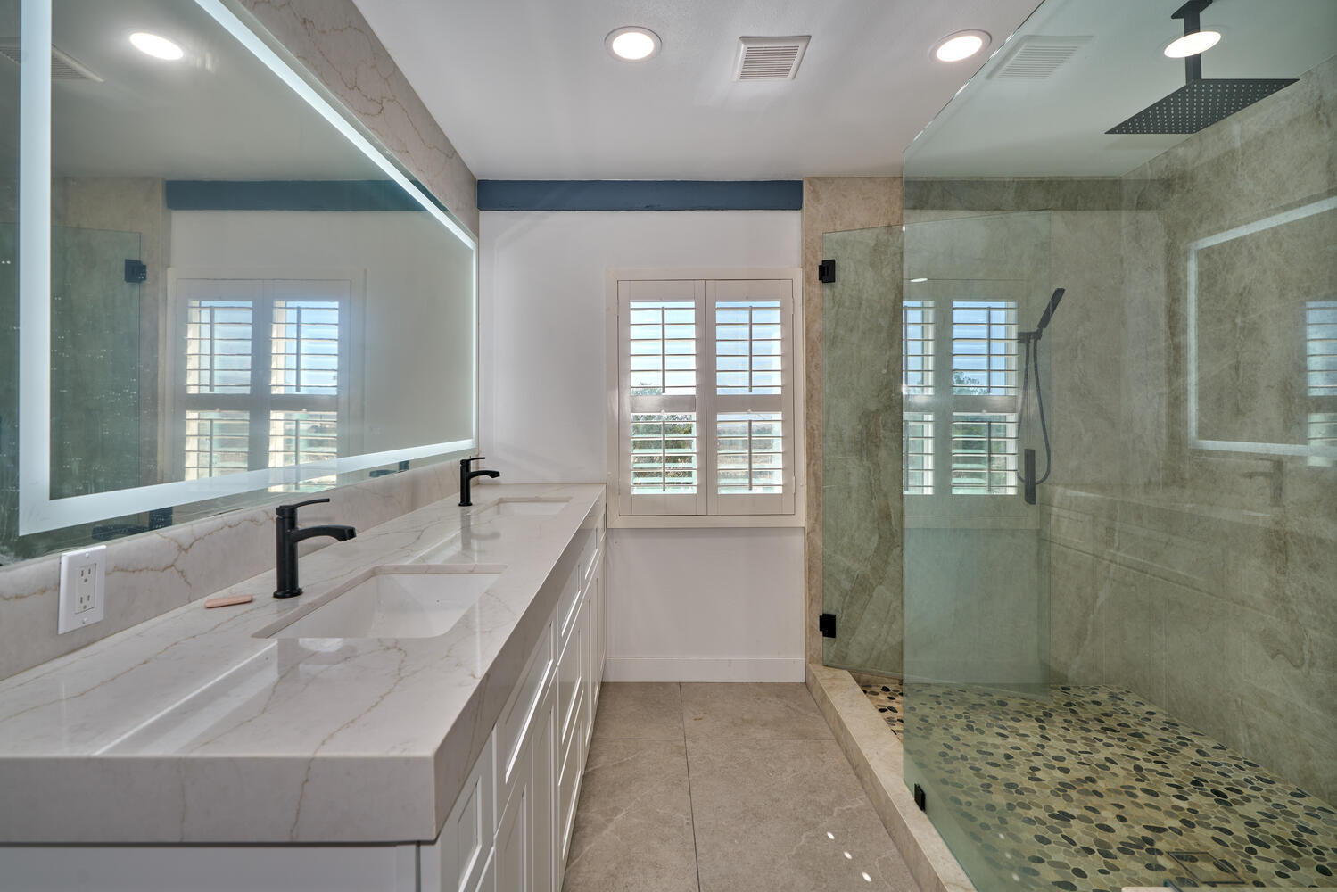 73300 Paradise Avenue Desert Hot Springs, CA 92241 - Photo 35 of 44 a bathroom with double vanity and a shower