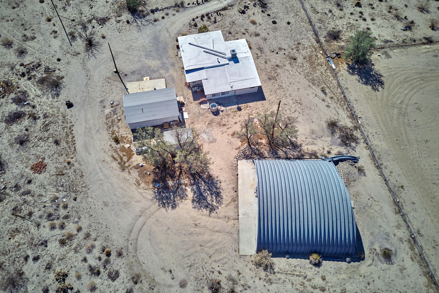 73300 Paradise Avenue Desert Hot Springs, CA 92241 - Photo 5 of 44 an aerial view of a house with a yard