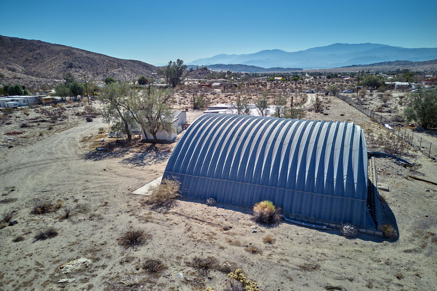 73300 Paradise Avenue Desert Hot Springs, CA 92241 - Photo 7 of 44 a view of a backyard with a patio