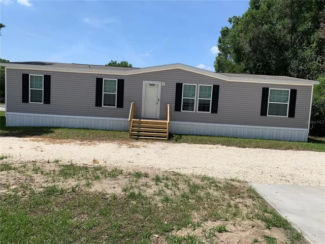 a house with trees in the background