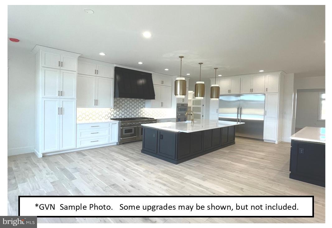 46 Chasen Court, Unit 35 Sinking Spring, PA 19608 - Photo 7 of 10 a large room with a large counter space and appliances