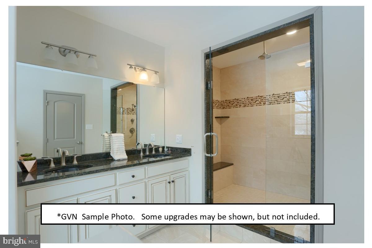 46 Chasen Court, Unit 35 Sinking Spring, PA 19608 - Photo 10 of 10 a bathroom with a granite countertop sink and a mirror