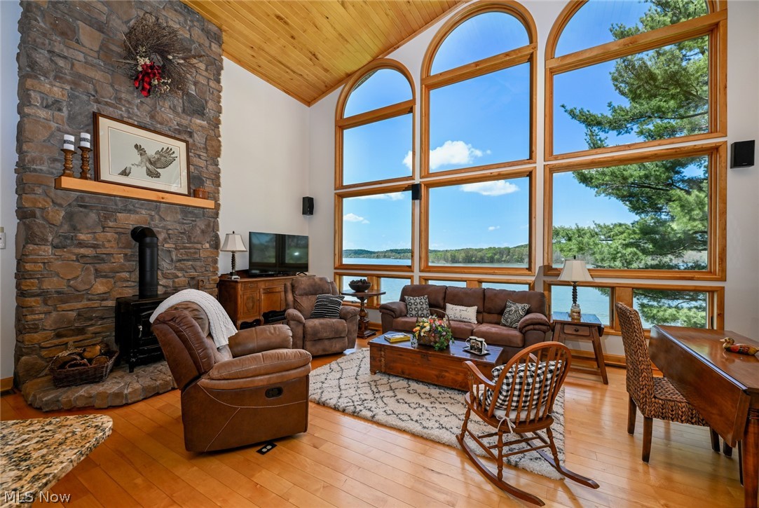 2873 Lodge Road Southwest Sherrodsville, OH 44675 - Photo 14 of 50 The great room is stunning with towering vaulted ceilings and a full wall of glass taking in the stunning views of Atwood Lake and it surround gently rolling wooded hillsides.