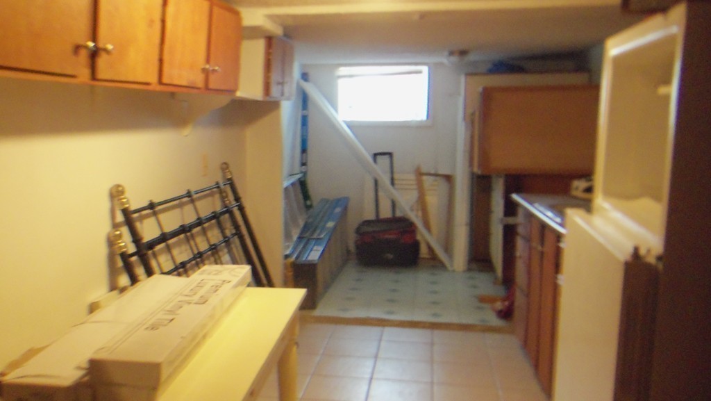 303 Rodman Street Fall River, MA 02721 - Photo 18 of 22 a utility room with a sink a washer and dryer
