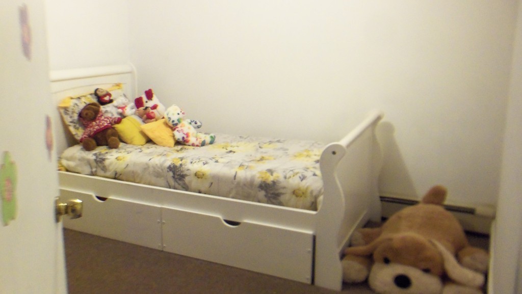 303 Rodman Street Fall River, MA 02721 - Photo 8 of 22 a bed room with a bed and a window