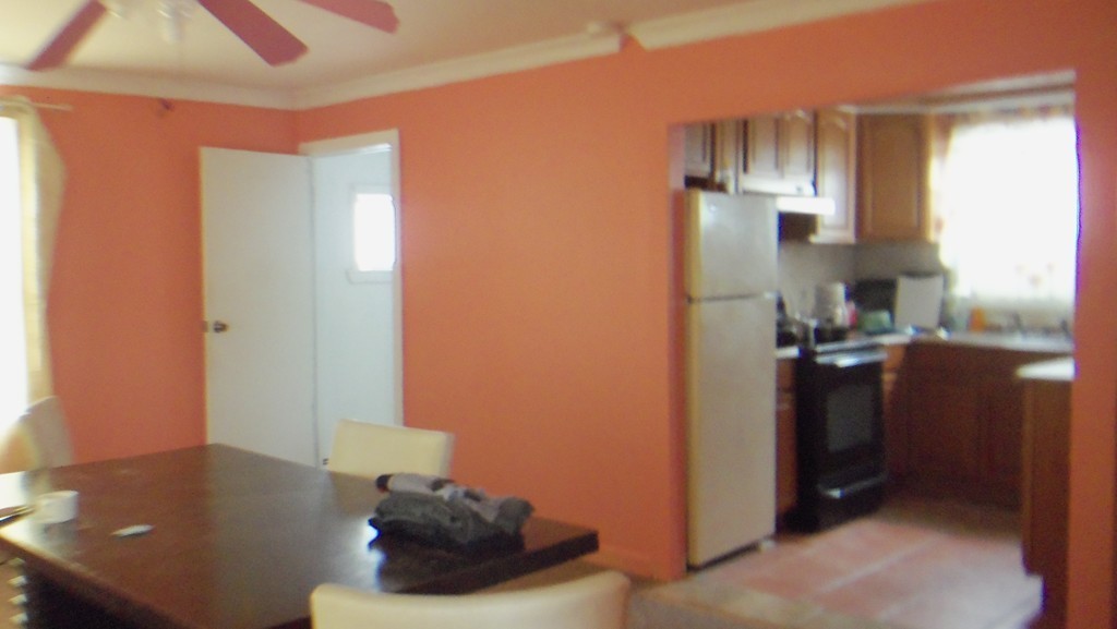 303 Rodman Street Fall River, MA 02721 - Photo 9 of 22 a kitchen with a sink and a refrigerator