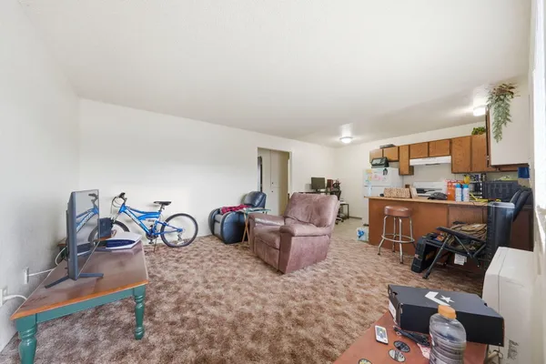 a view of a livingroom with furniture and a chair