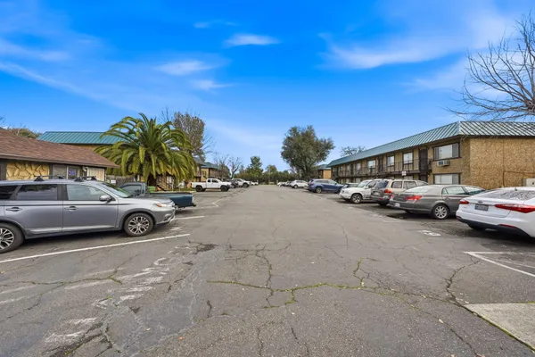 a view of a house with a backyard