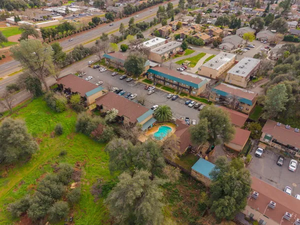 an aerial view of residential building and ocean view