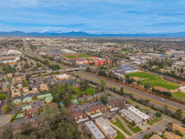 an aerial view of residential building and lake