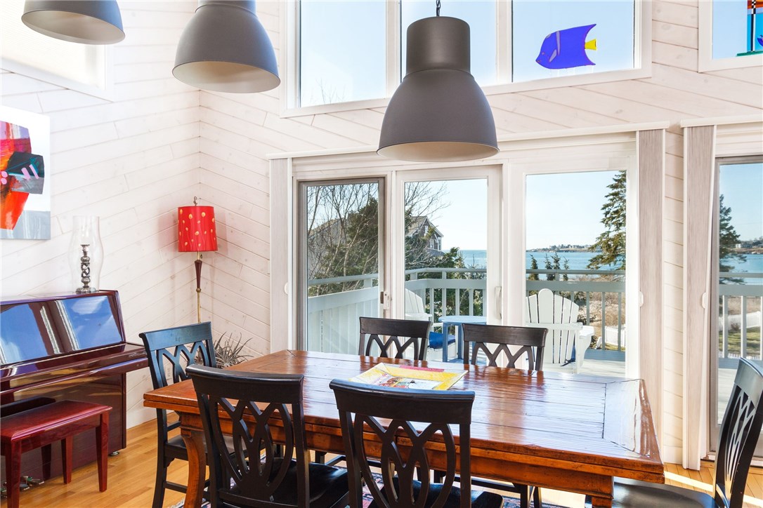 8 Dunes Road Narragansett, RI 02882 - Photo 4 of 39 Dining area w/ ocean views & sliders to wraparound deck