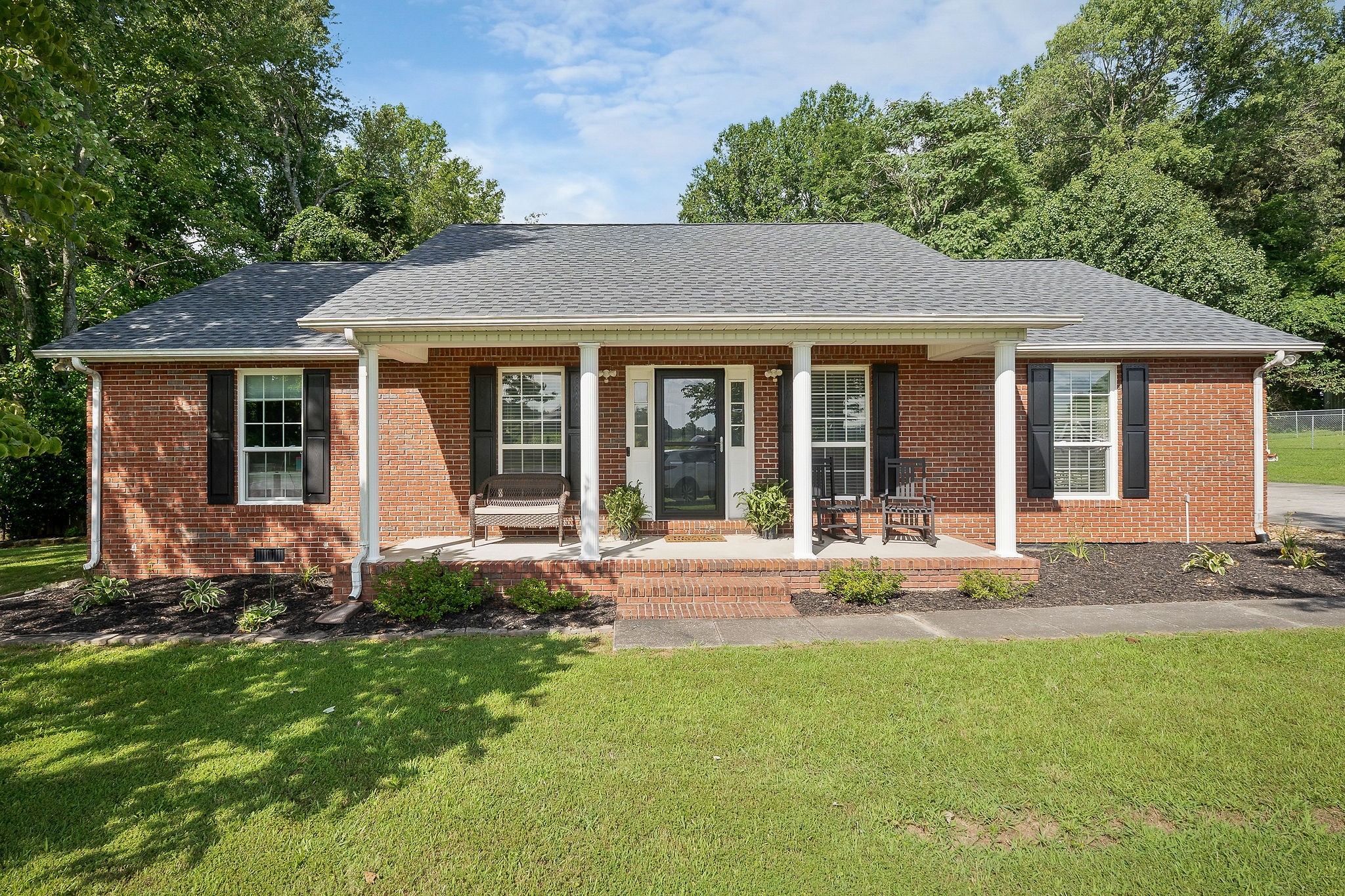 front view of a house with a yard