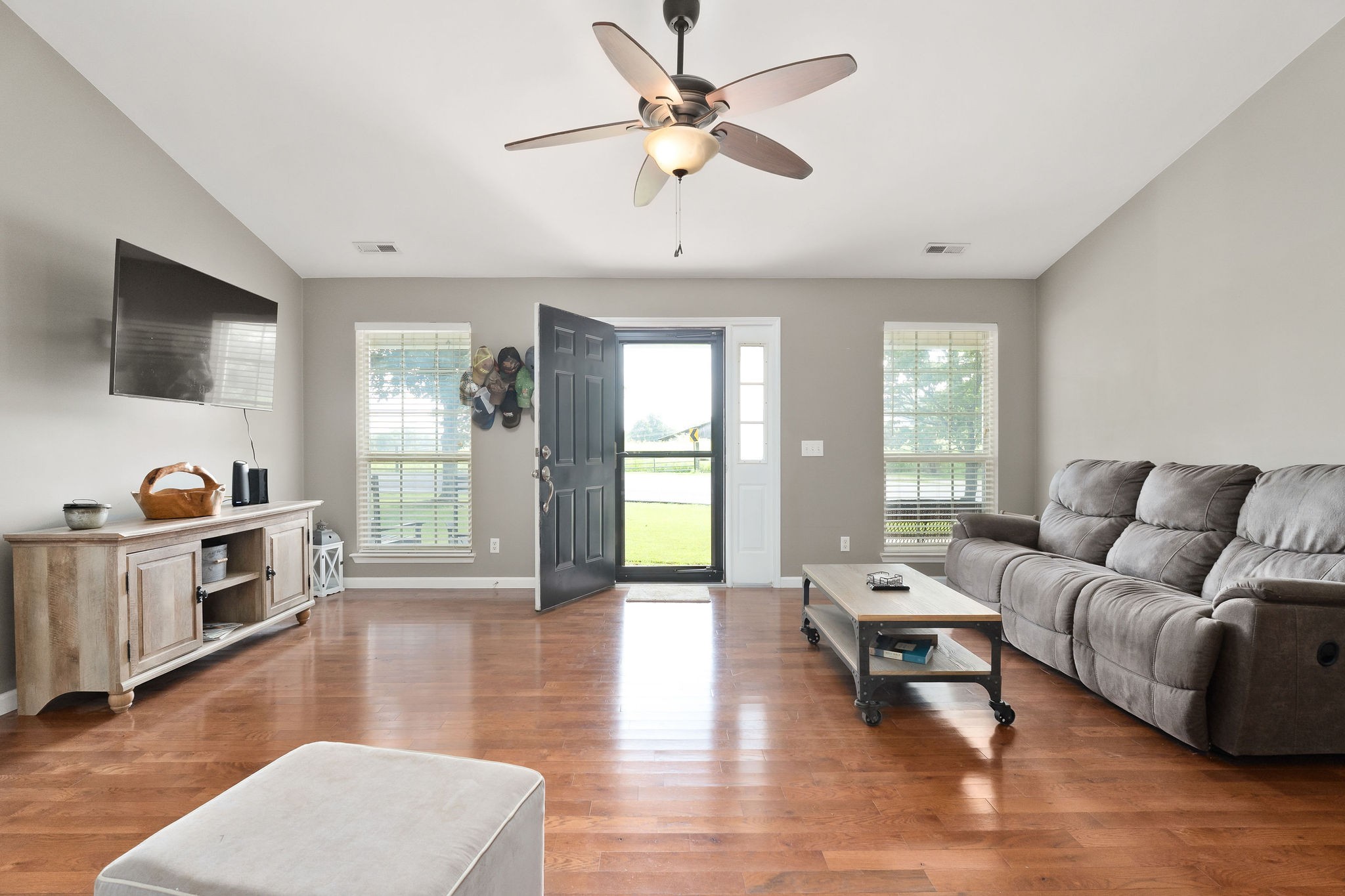 143 Old Qualls Road Cookeville, TN 38506 - Photo 13 of 40 a living room with furniture and a flat screen tv