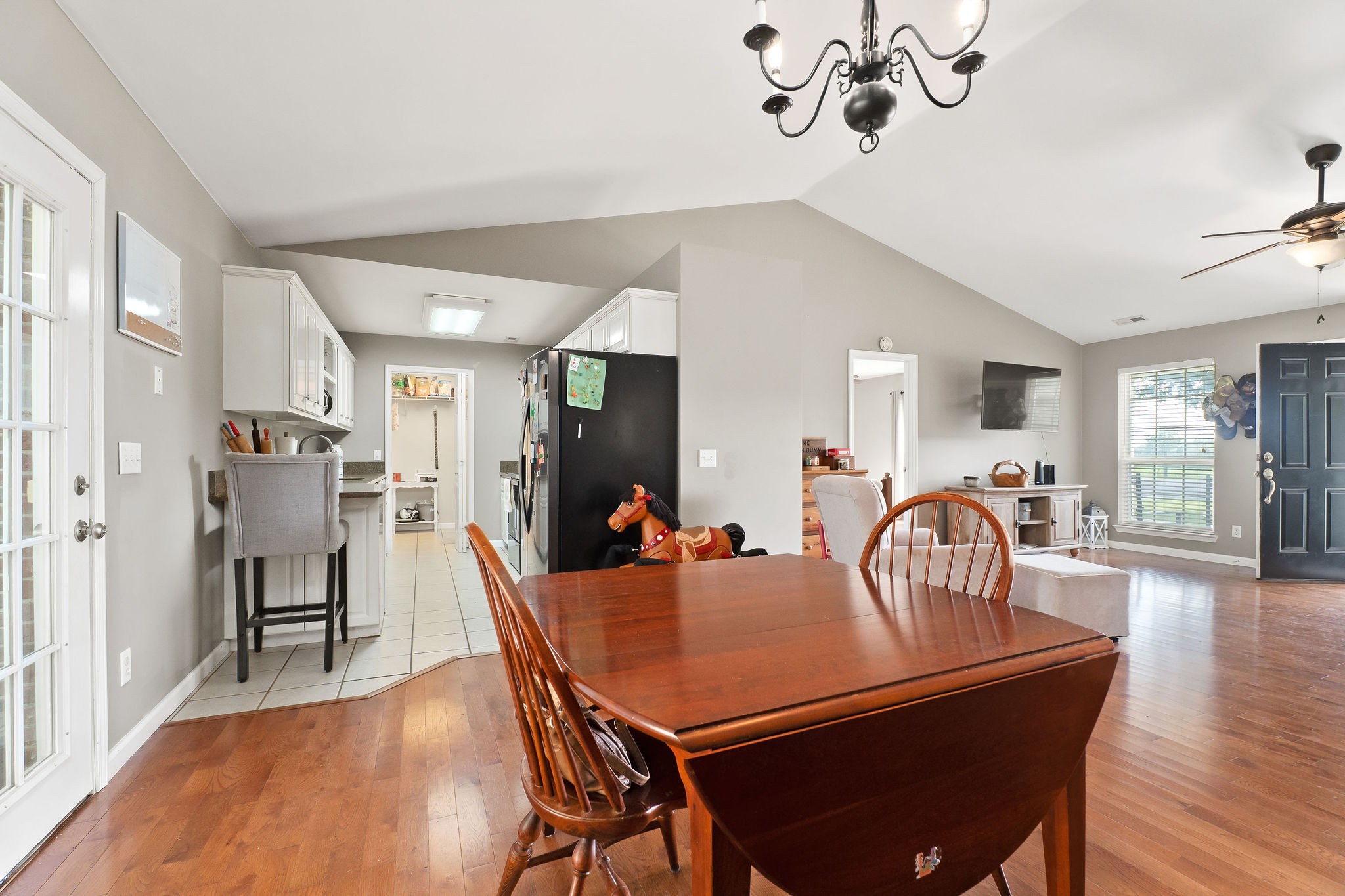 143 Old Qualls Road Cookeville, TN 38506 - Photo 16 of 40 a dining room with furniture a chandelier and wooden floor