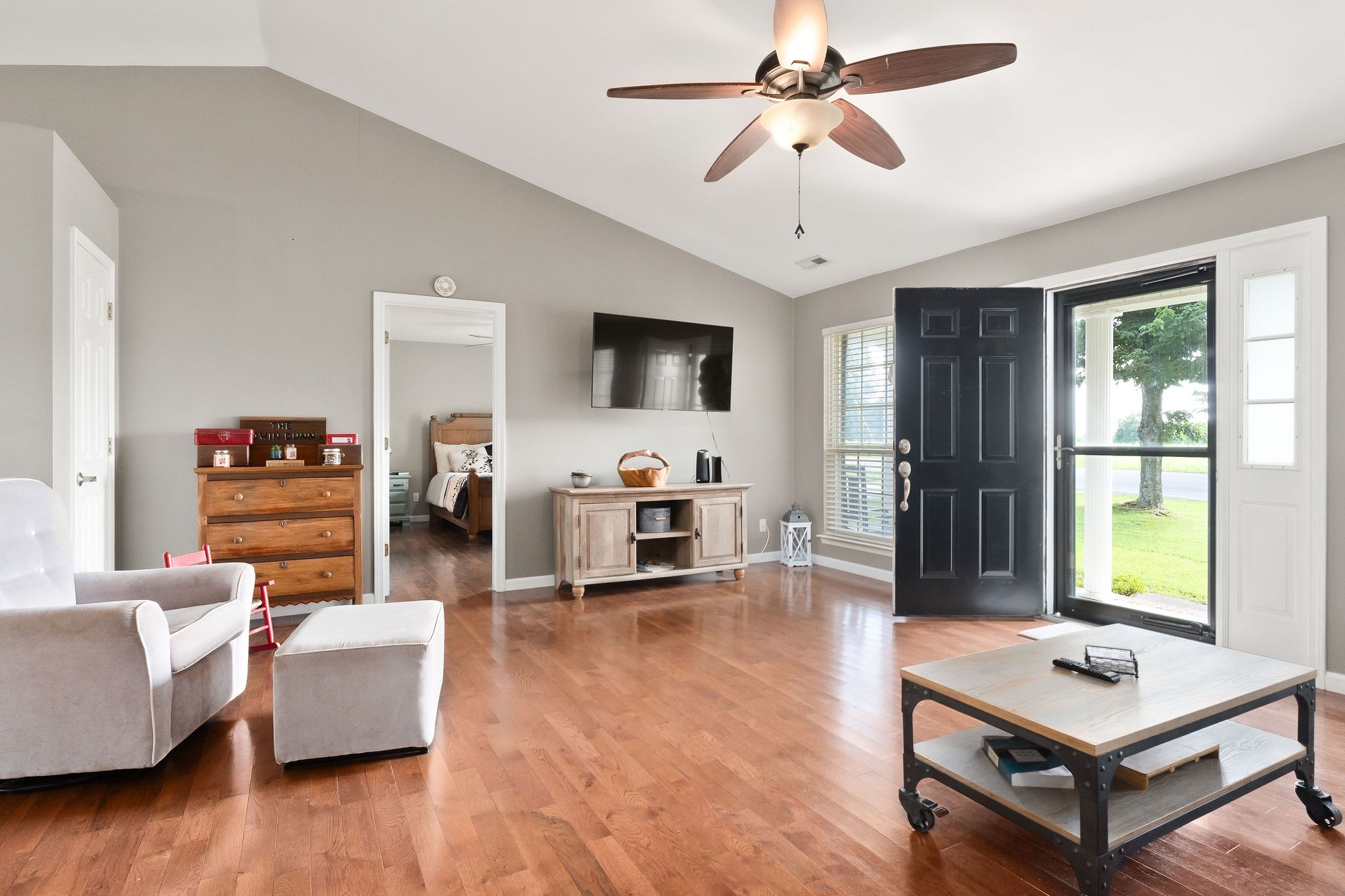 143 Old Qualls Road Cookeville, TN 38506 - Photo 17 of 40 a living room with furniture and a flat screen tv