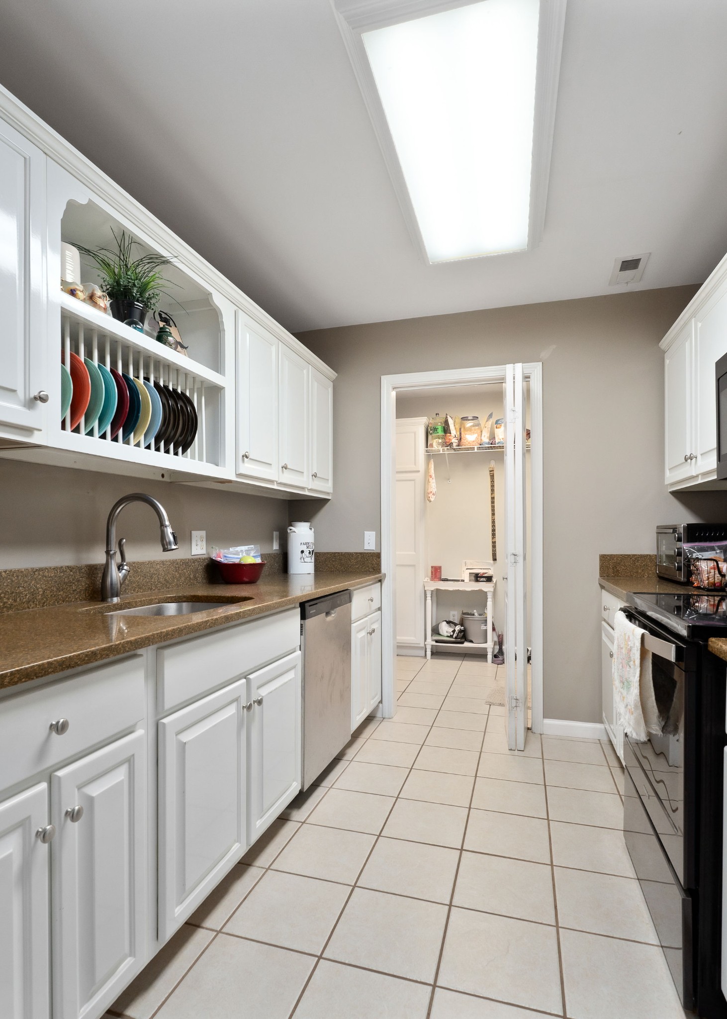 143 Old Qualls Road Cookeville, TN 38506 - Photo 22 of 40 a kitchen with a sink and cabinets