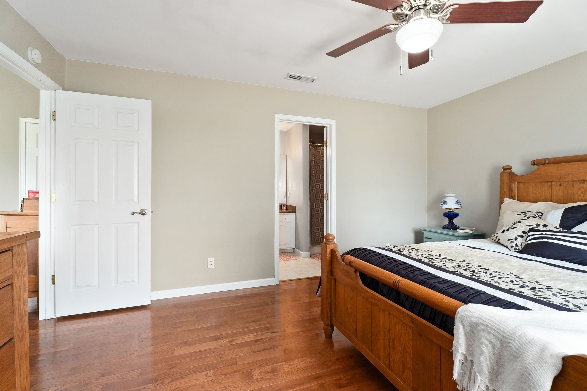 143 Old Qualls Road Cookeville, TN 38506 - Photo 25 of 40 a bedroom with bed and wooden floor