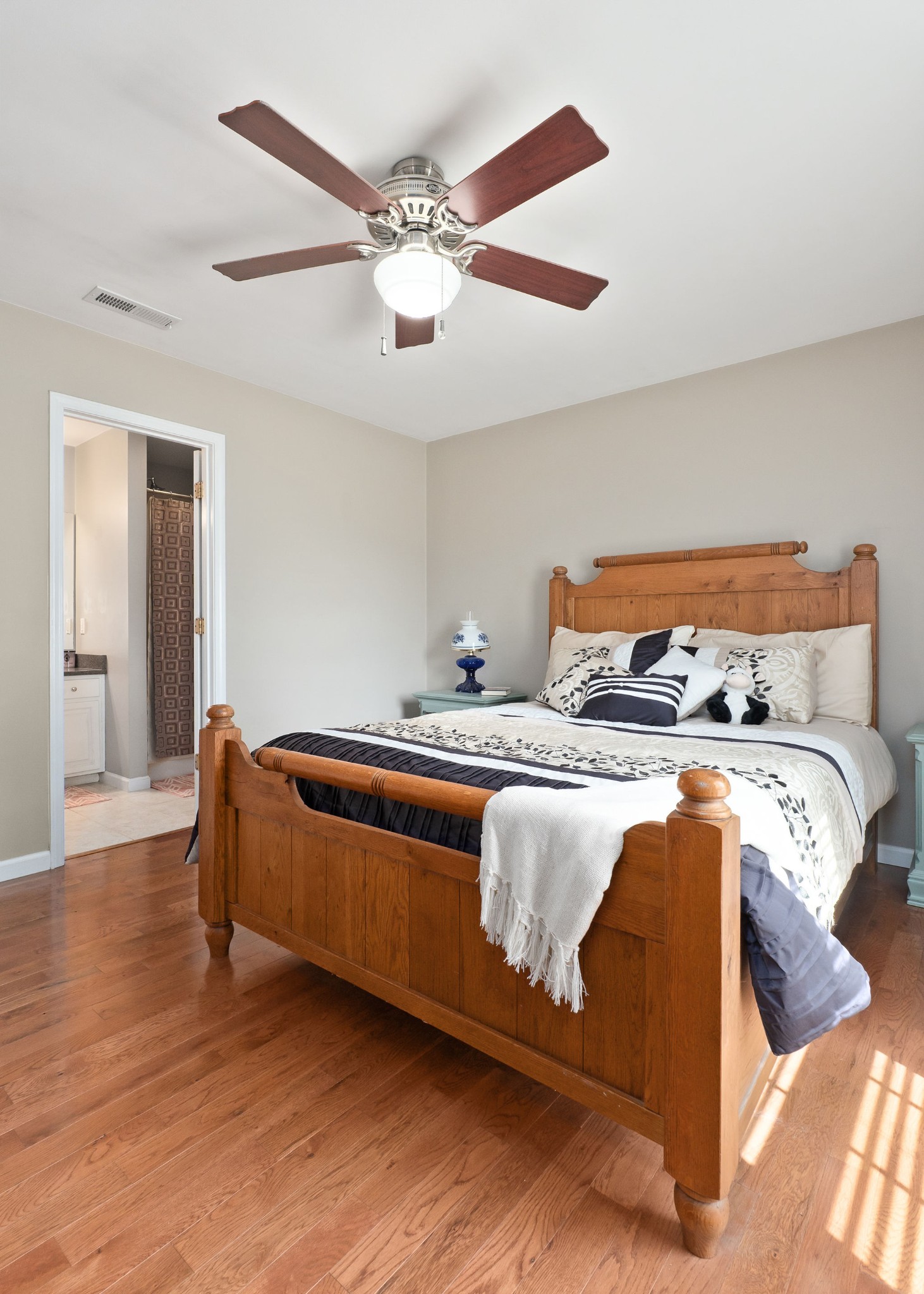 143 Old Qualls Road Cookeville, TN 38506 - Photo 26 of 40 a bedroom with a bed and wooden floor