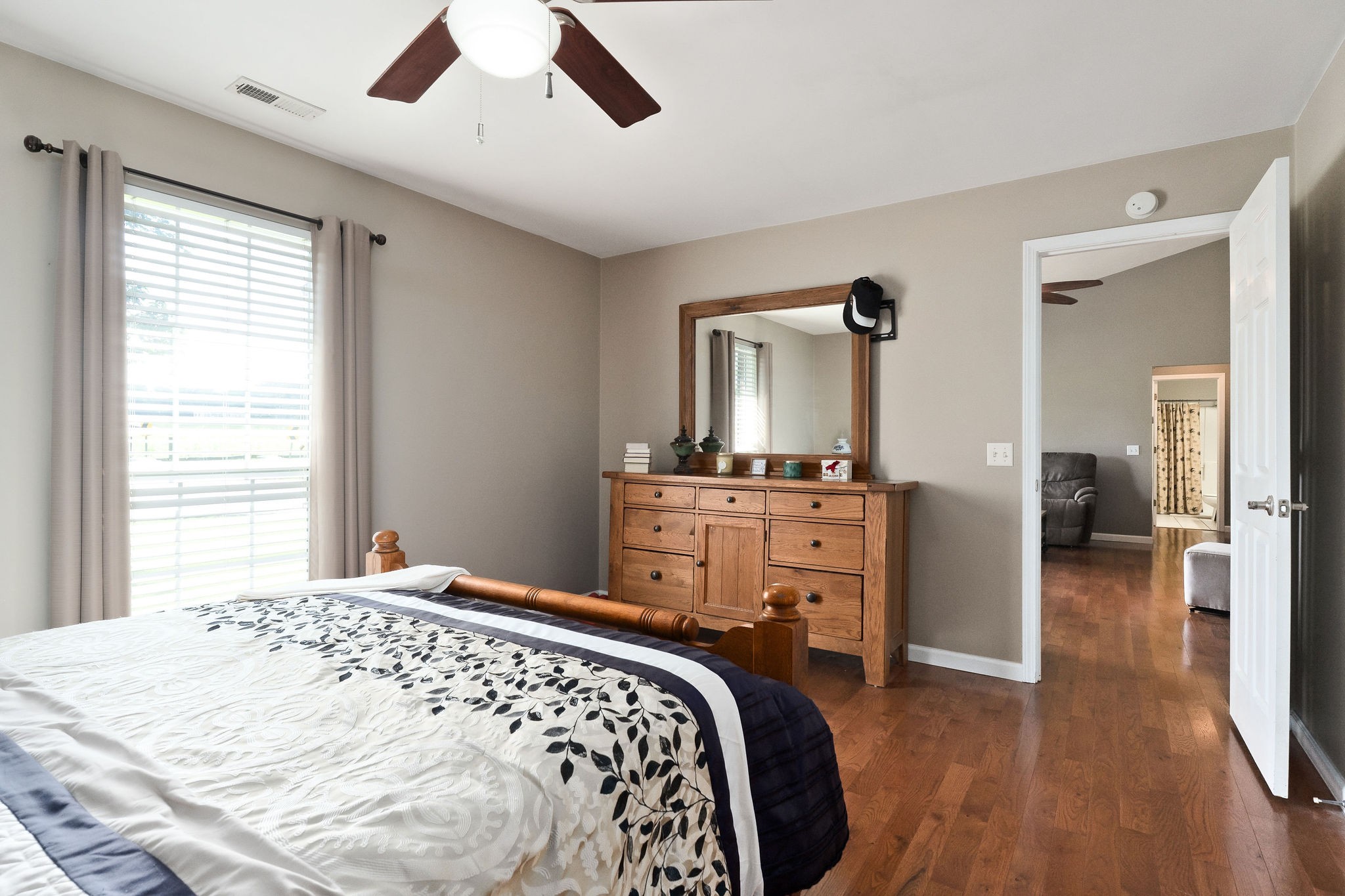 143 Old Qualls Road Cookeville, TN 38506 - Photo 28 of 40 a bedroom with a bed and wooden floor