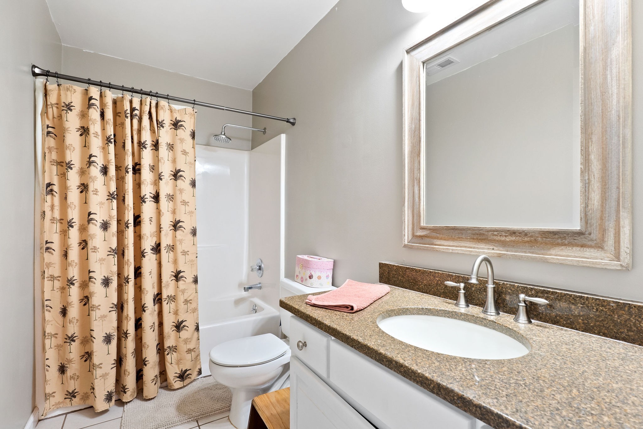 143 Old Qualls Road Cookeville, TN 38506 - Photo 29 of 40 a bathroom with a granite countertop sink toilet a mirror and shower curtain