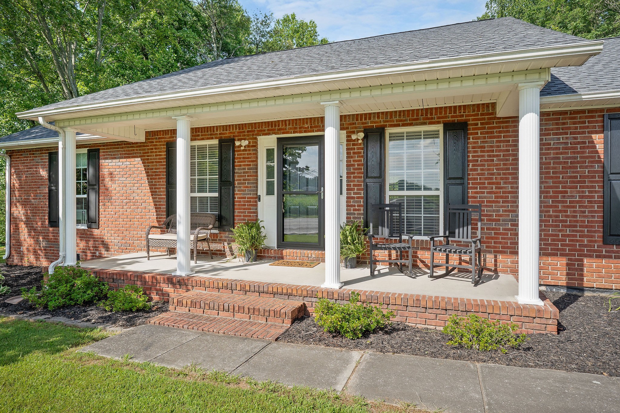 143 Old Qualls Road Cookeville, TN 38506 - Photo 3 of 40 a building outdoor space with a garden