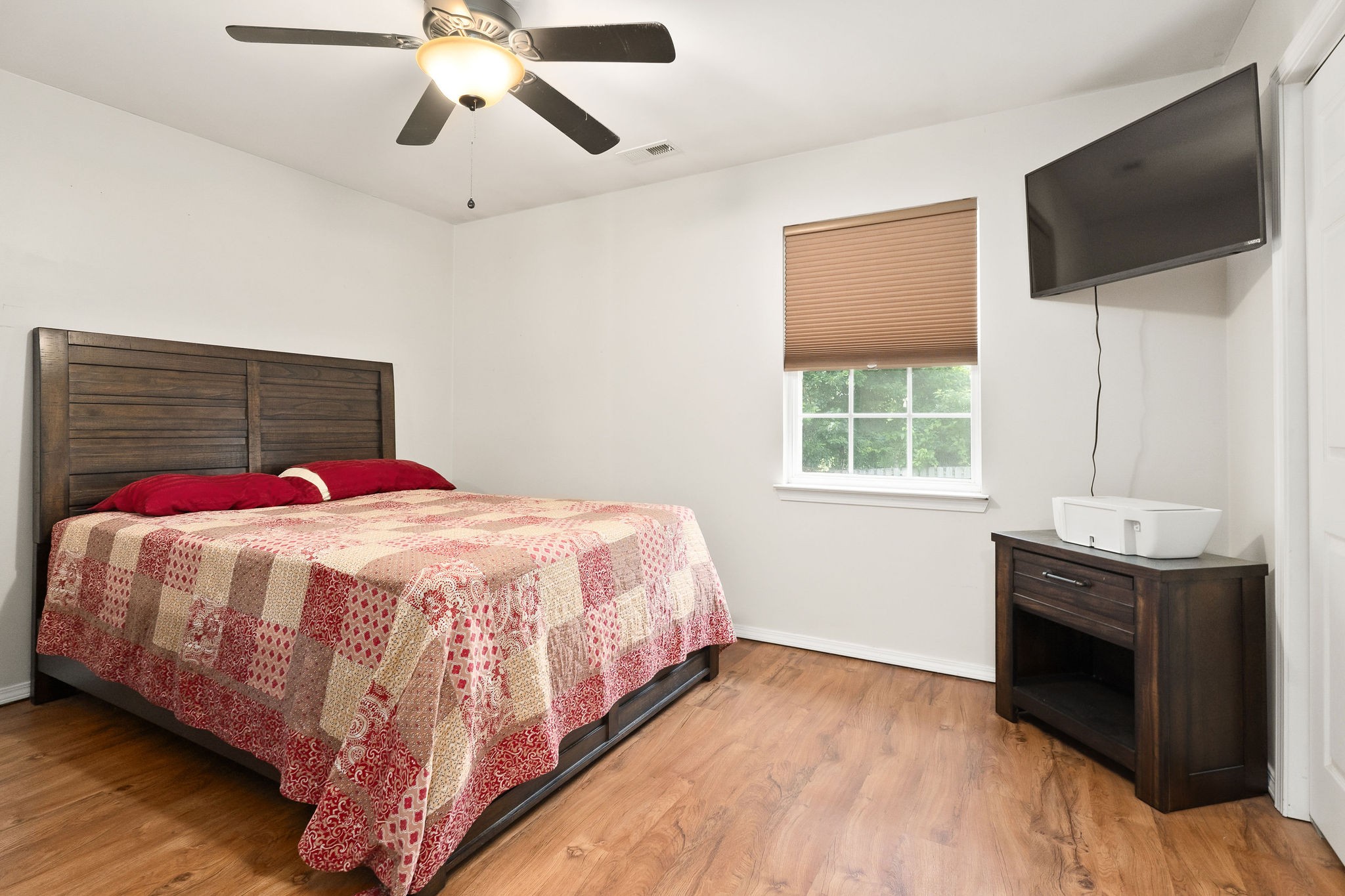 143 Old Qualls Road Cookeville, TN 38506 - Photo 32 of 40 a bedroom with a bed and a flat screen tv