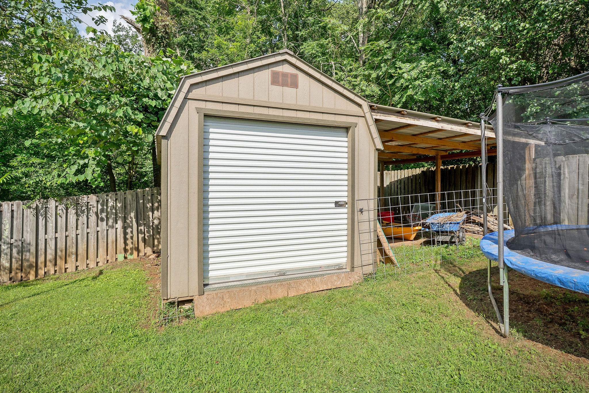 143 Old Qualls Road Cookeville, TN 38506 - Photo 40 of 40 a view of backyard with small cabin and wooden fence