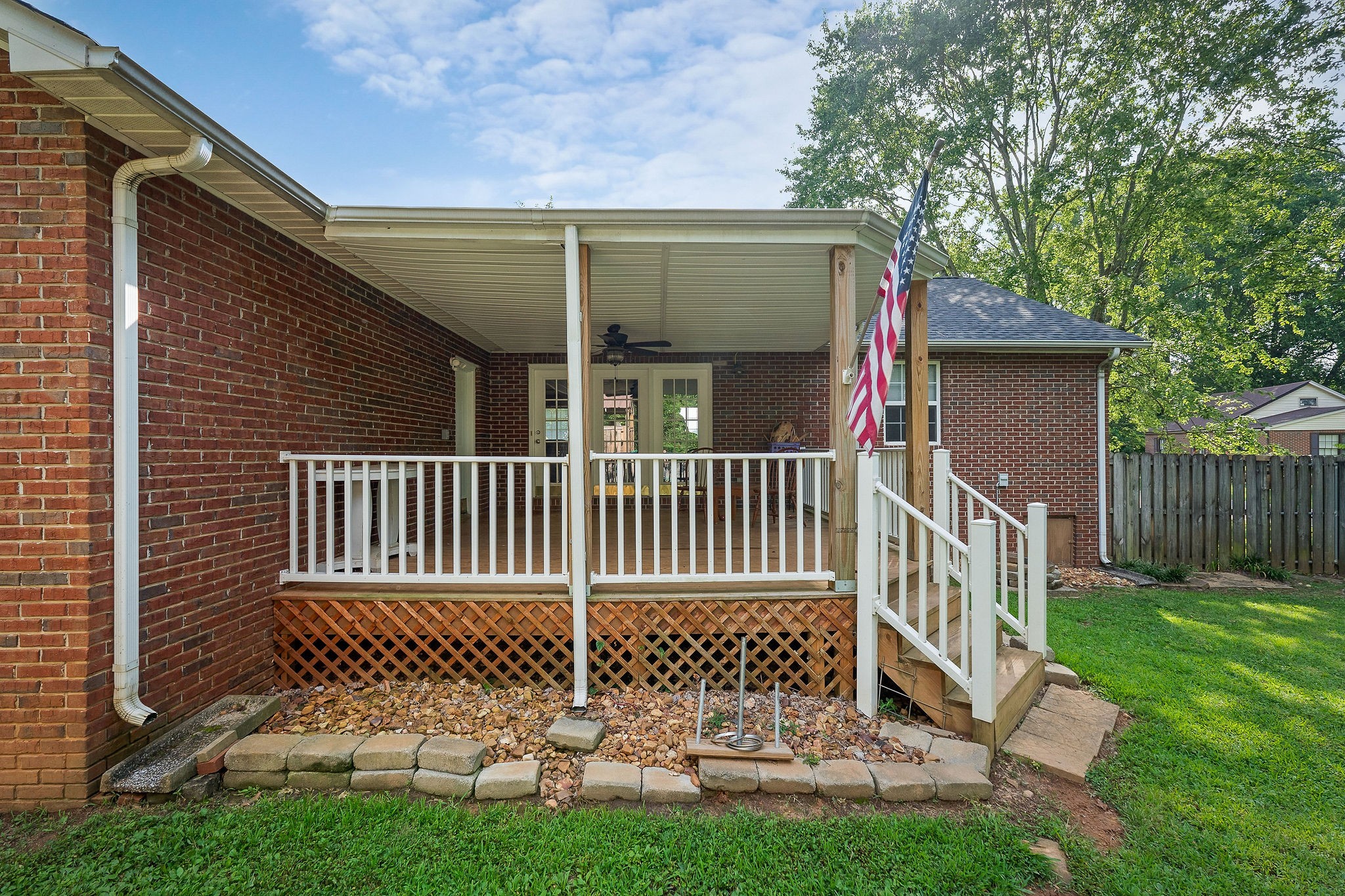 143 Old Qualls Road Cookeville, TN 38506 - Photo 6 of 40 a view of a house with a small yard and wooden fence